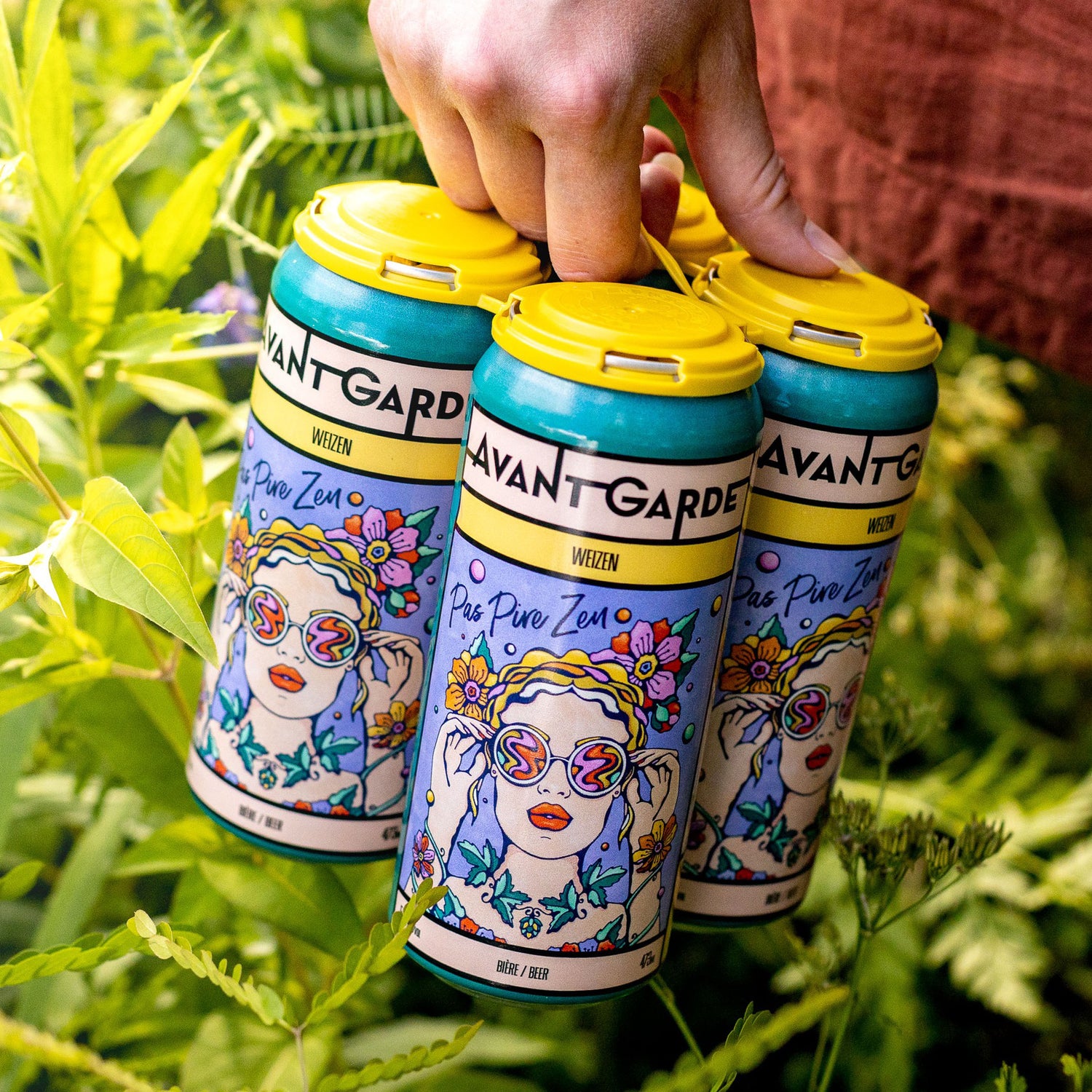 Illustrated german wheat beer cans in hand