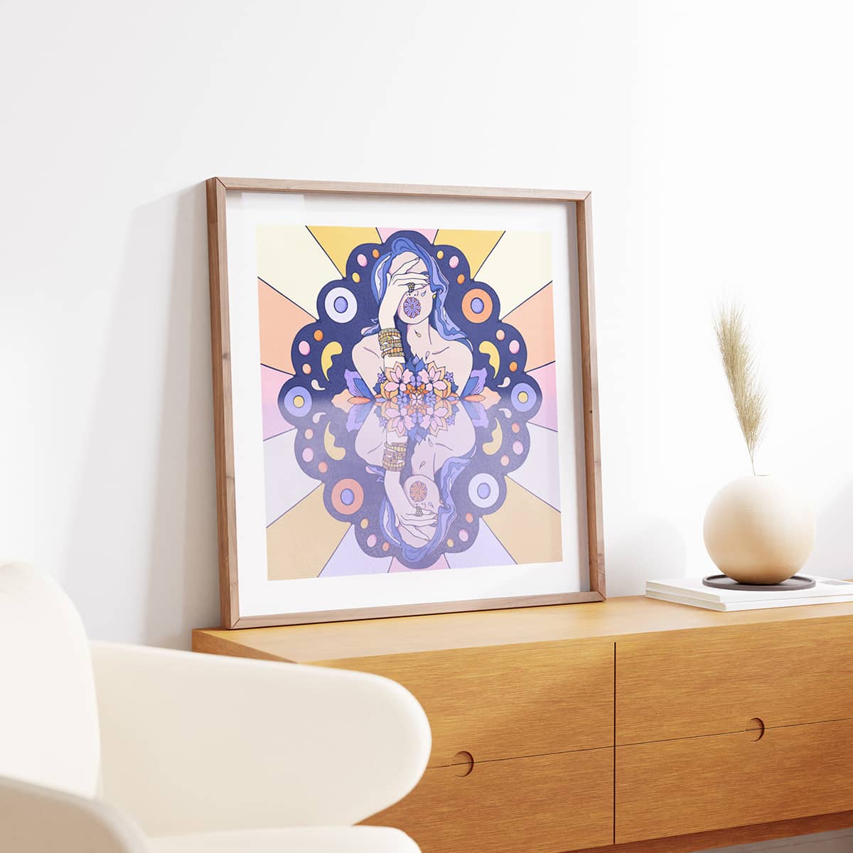 Blue and pink graphic illustration of a woman crying on display in a scandi interior